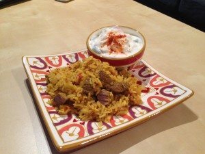 Raita, served with a plate of biryani