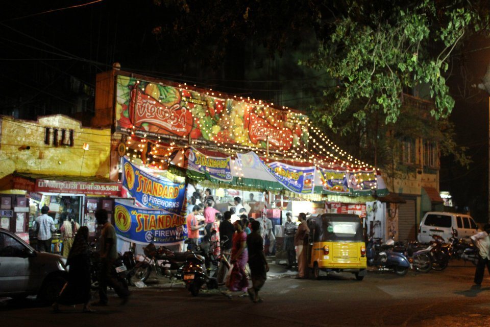 A fireworks stall lit up in a Chennai neighbourhood