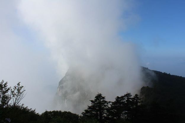 Morning mist rises off Mt E'mei