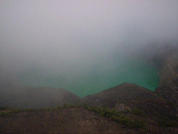 Mist enshrouds Kelimutu's Turquoise lake