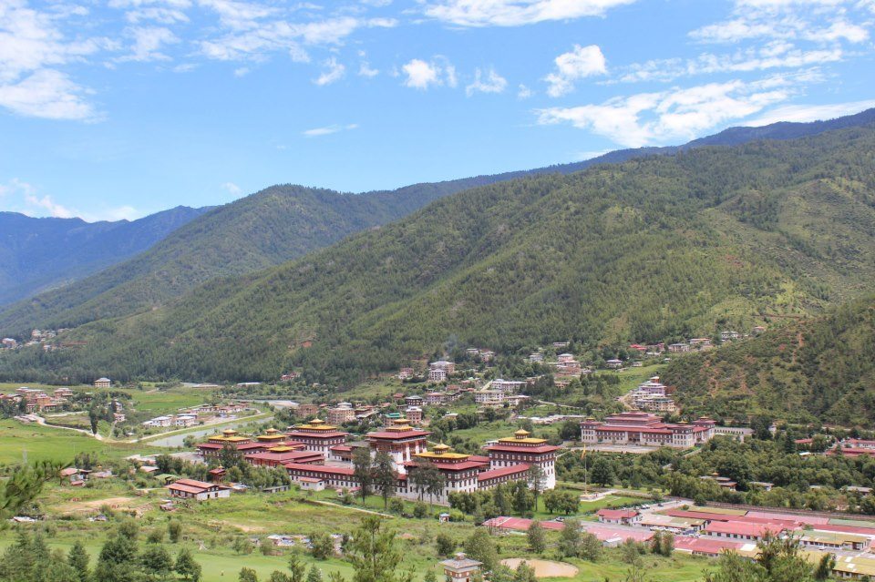 Trashi Chhoe Dzong (Thimphu Monastery) in the foreground, and just behind it to the right, Bhutan's parliament house, in Thimphu, Bhutan's capital