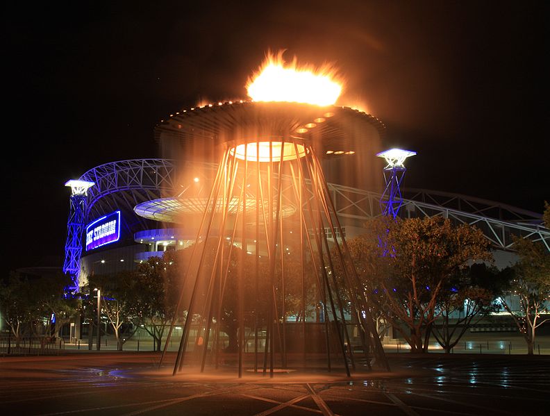 The Sydney Olympic Cauldron in its current home outside the stadium in Olympic Park, remodelled to immortalise the moment when it rose from a pool of water. (Image: Adam J. W. C., Wikimedia Commons)